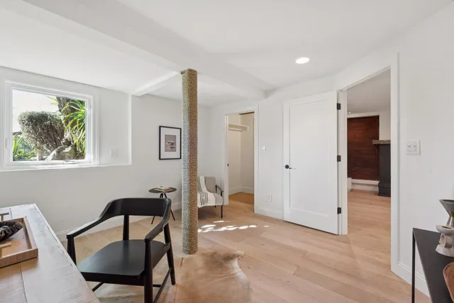 a view of a patio with table and chairs and potted plants