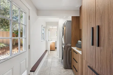 a front view of a house with outdoor seating