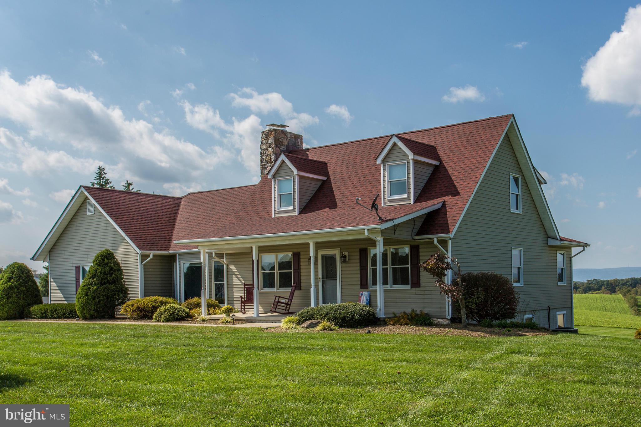 11841 Renner Road Keymar, MD 21757 - Photo 1 of 30 a front view of a house with a garden and porch
