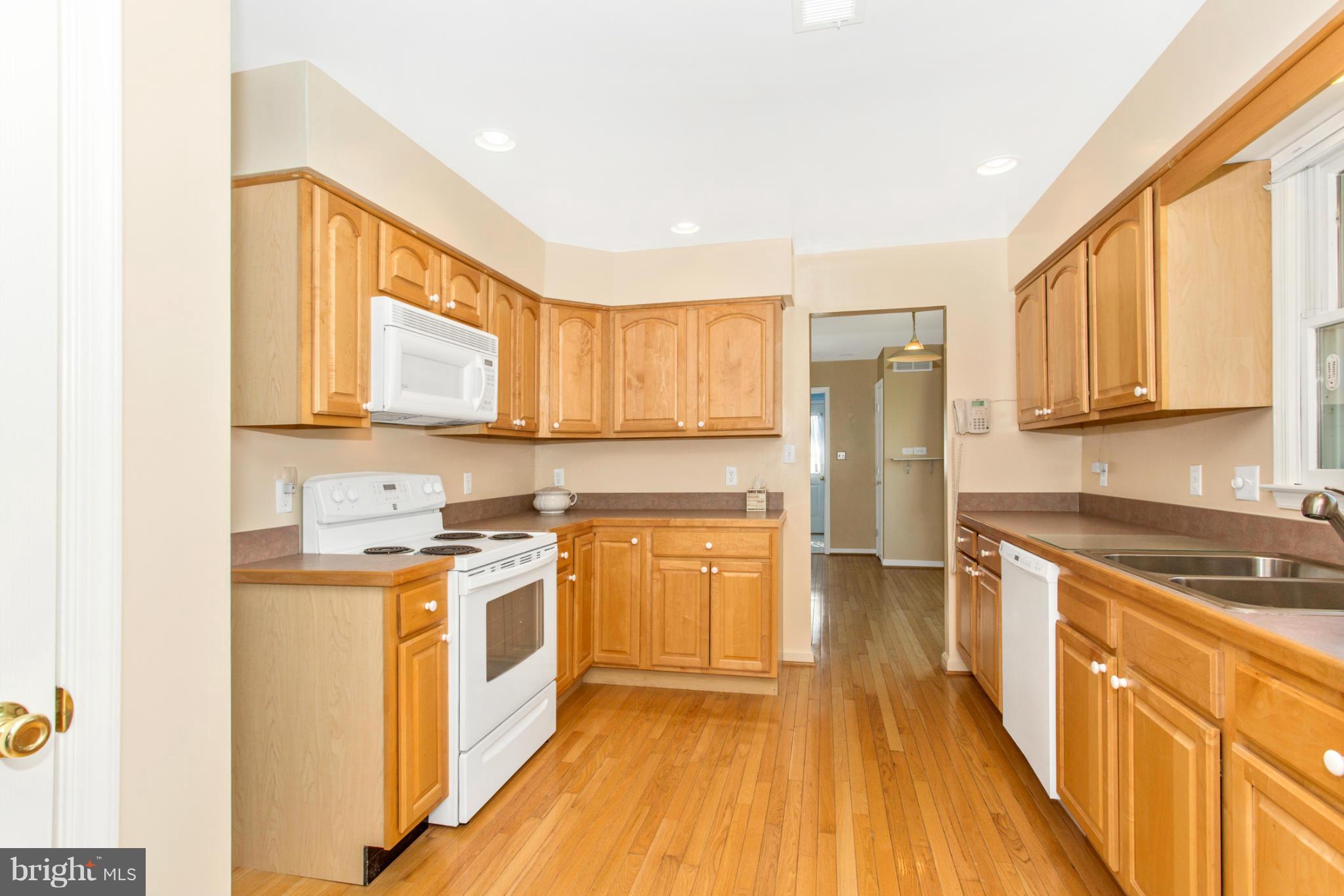 11841 Renner Road Keymar, MD 21757 - Photo 14 of 30 a kitchen with stainless steel appliances granite countertop a stove a sink dishwasher and a refrigerator