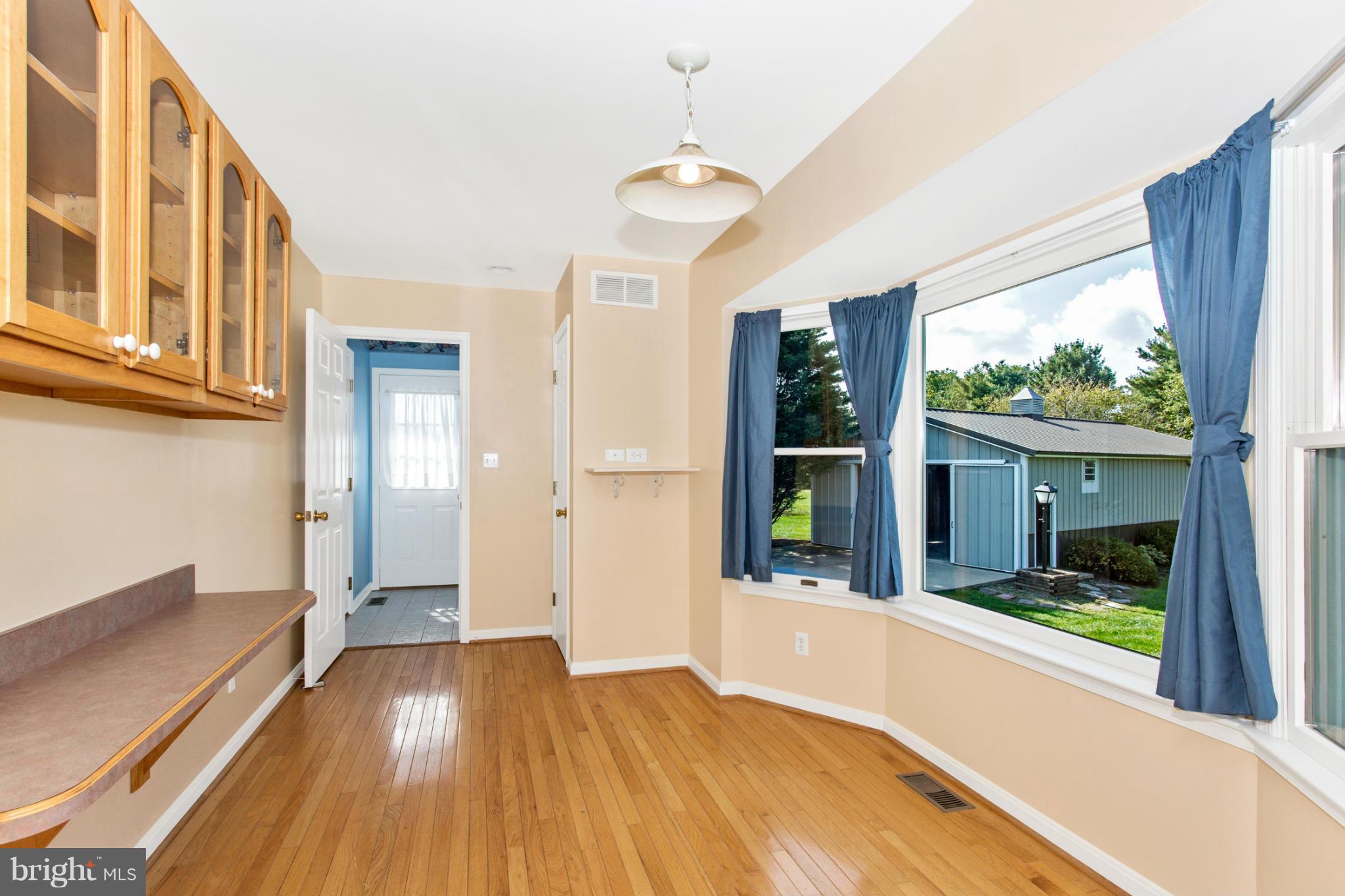 11841 Renner Road Keymar, MD 21757 - Photo 16 of 30 a view of an entryway with wooden floor and a livingroom