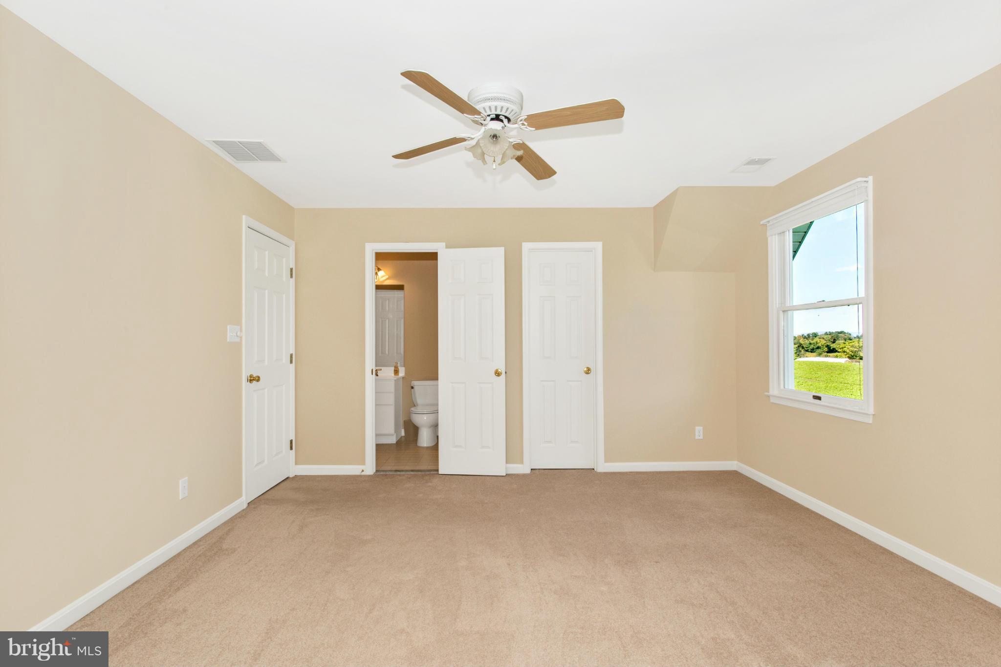 11841 Renner Road Keymar, MD 21757 - Photo 26 of 30 a view of a livingroom with a ceiling fan and window