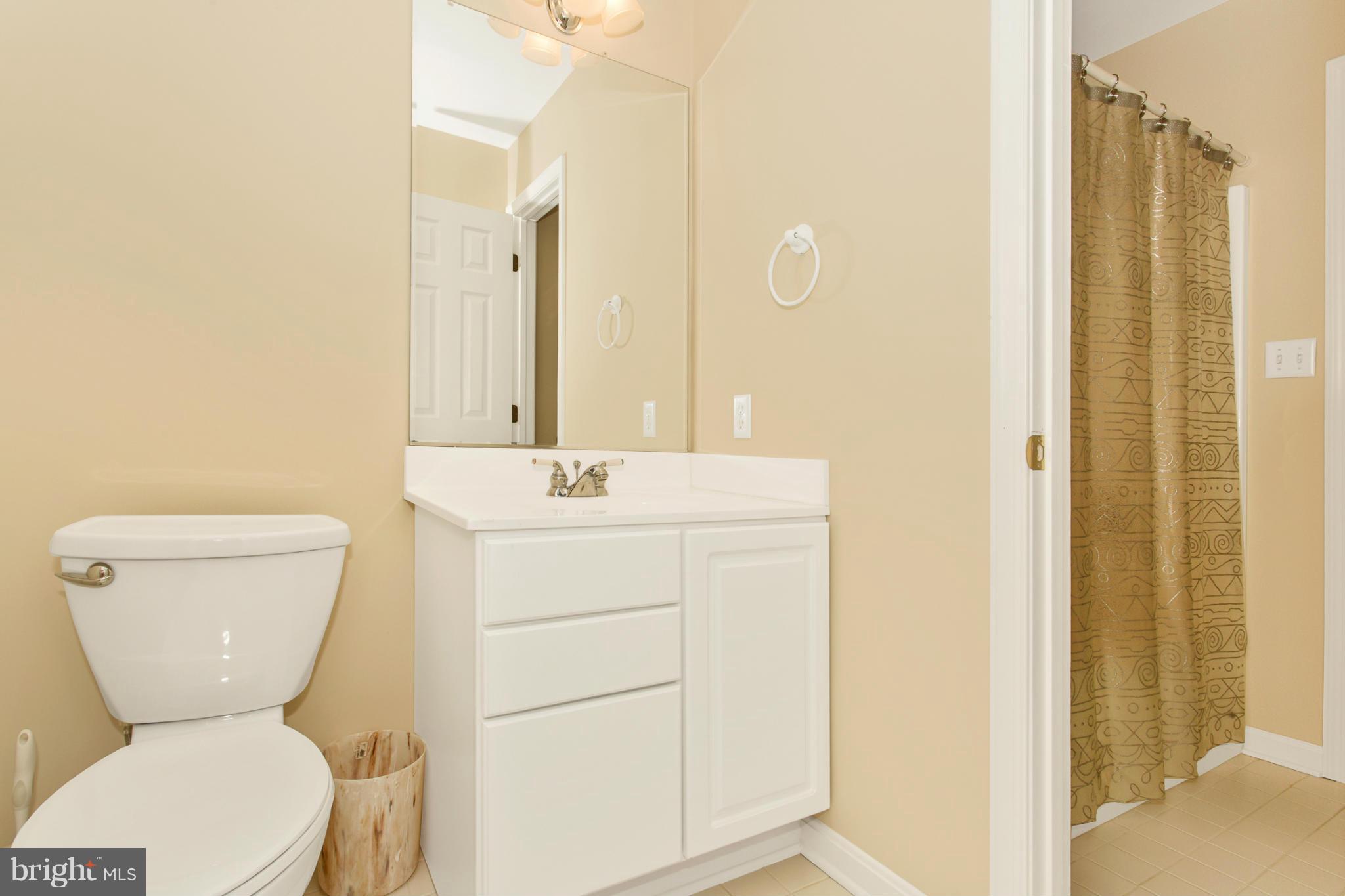 11841 Renner Road Keymar, MD 21757 - Photo 27 of 30 a bathroom with a toilet sink shower and mirror