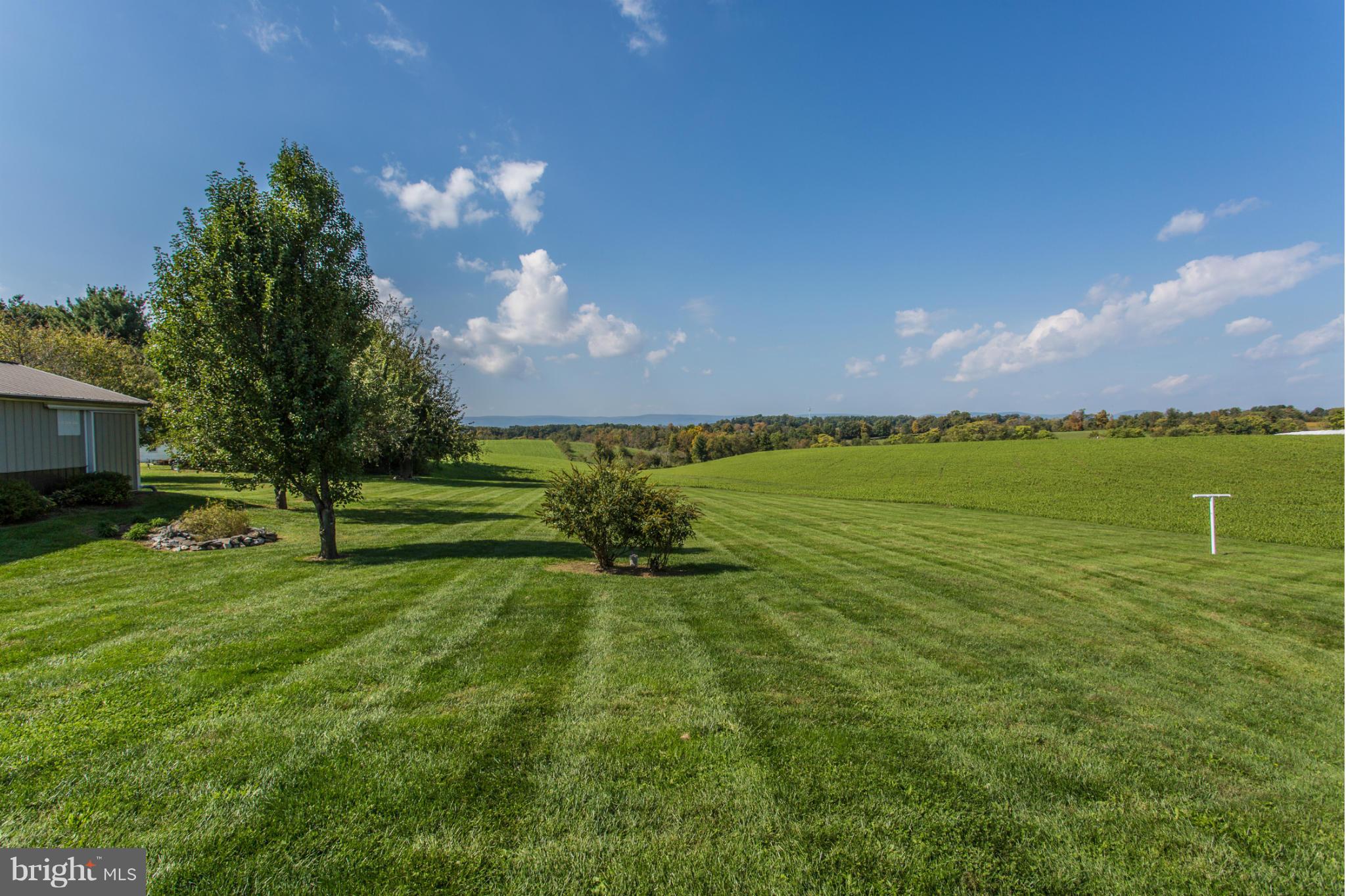 11841 Renner Road Keymar, MD 21757 - Photo 7 of 30 a view of a golf course with a lake