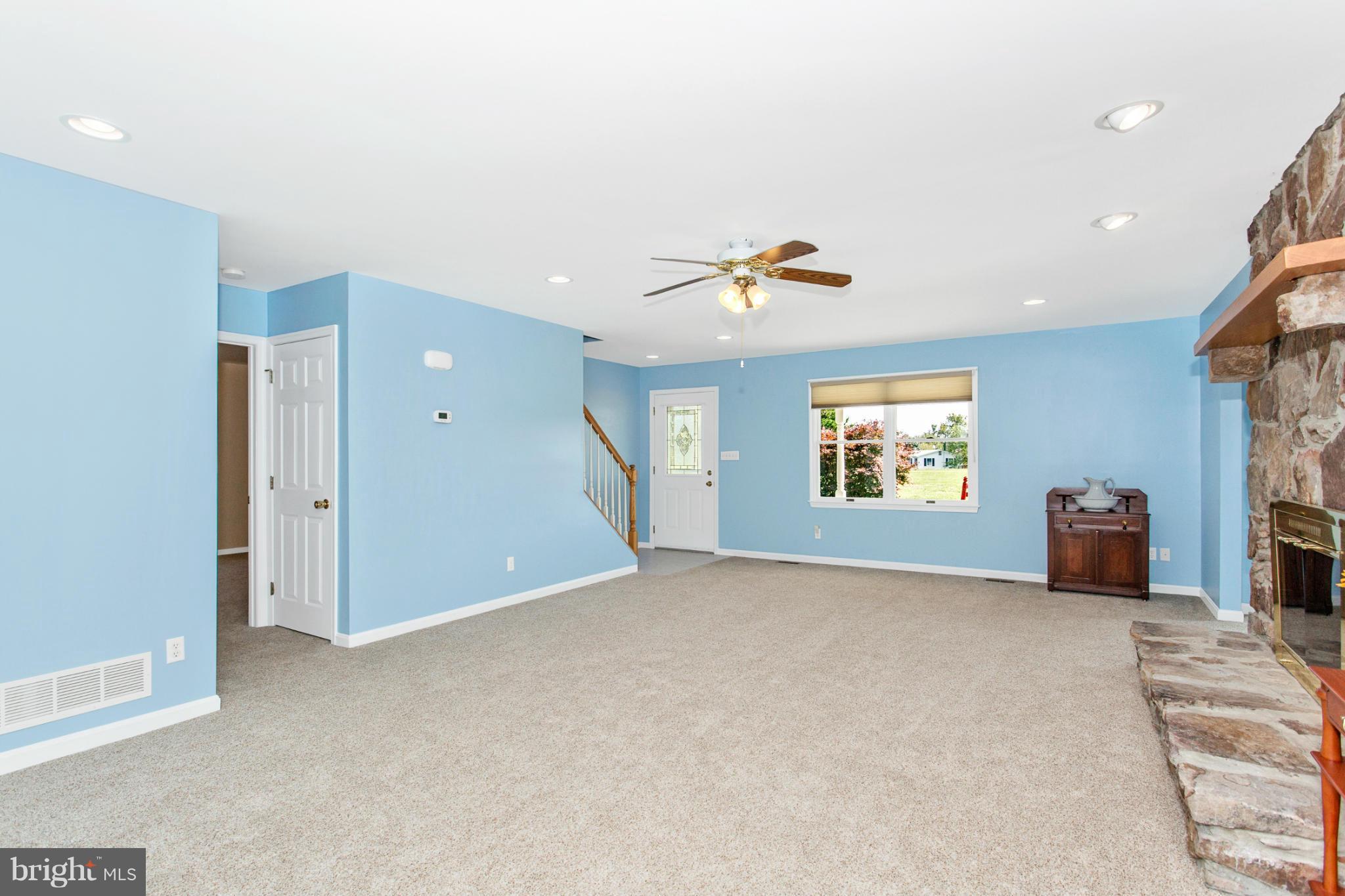 11841 Renner Road Keymar, MD 21757 - Photo 9 of 30 an empty room with windows and ceiling fan