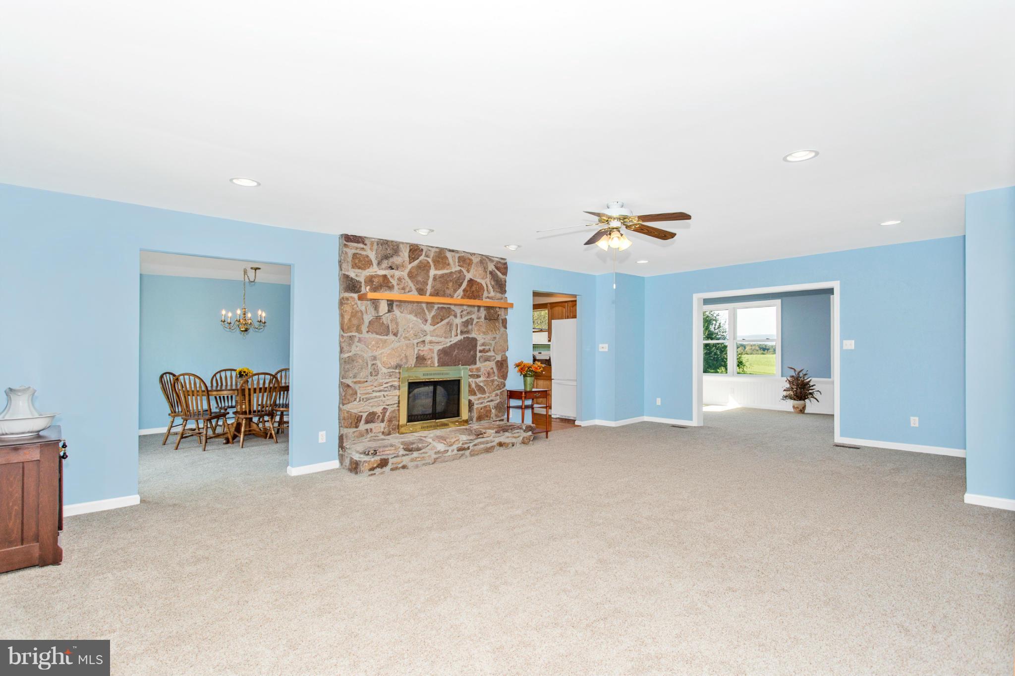 11841 Renner Road Keymar, MD 21757 - Photo 10 of 30 an empty room with furniture and a fireplace