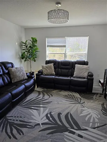 a living room with furniture and a couch