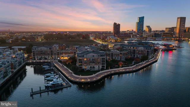 a living room with furniture a rug and a fireplace