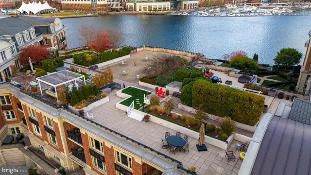 an aerial view of residential houses with lake view