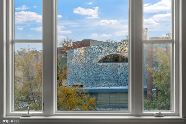 a kitchen with a sink cabinets and refrigerator