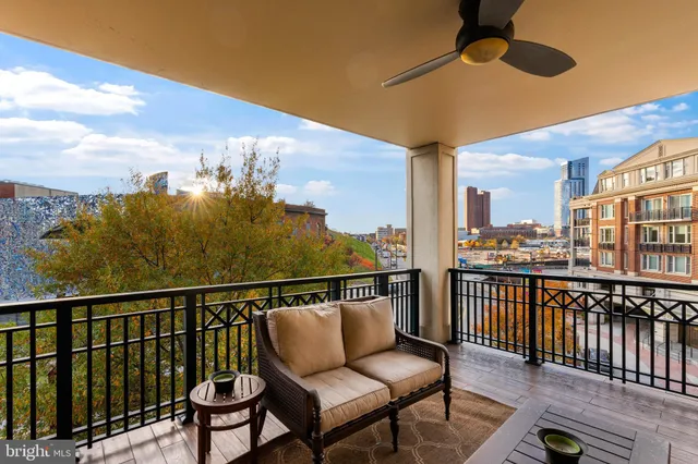 a view of a lake with boats and trees in the background