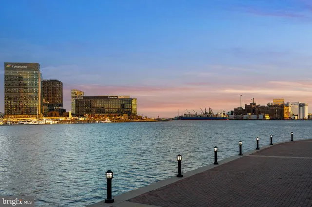 a large kitchen with a table and chairs