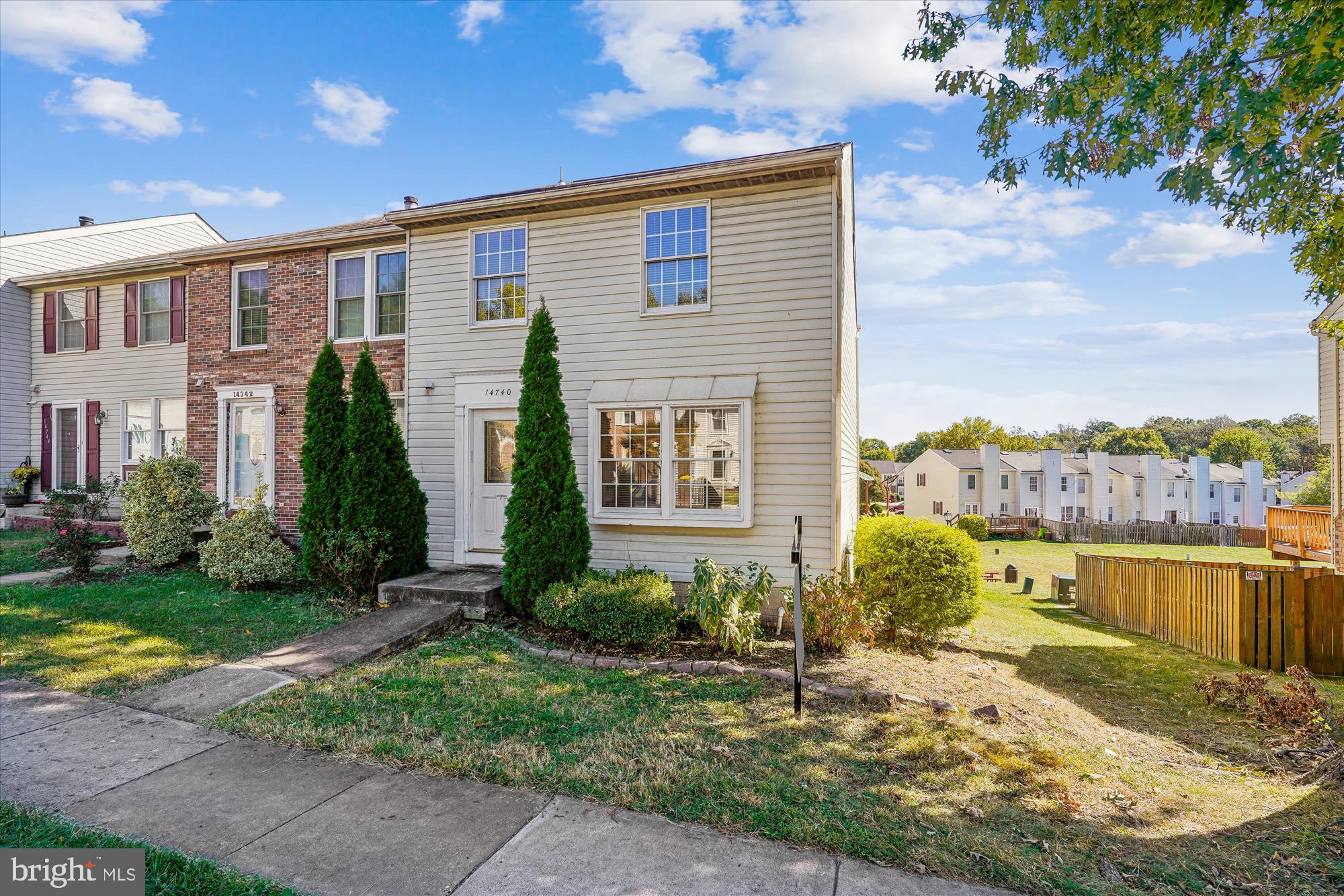 14740 Winding Loop Woodbridge, VA 22191 - Photo 1 of 59 a view of a brick house with a yard