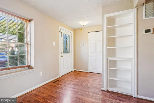 a kitchen with stainless steel appliances granite countertop a refrigerator stove and sink
