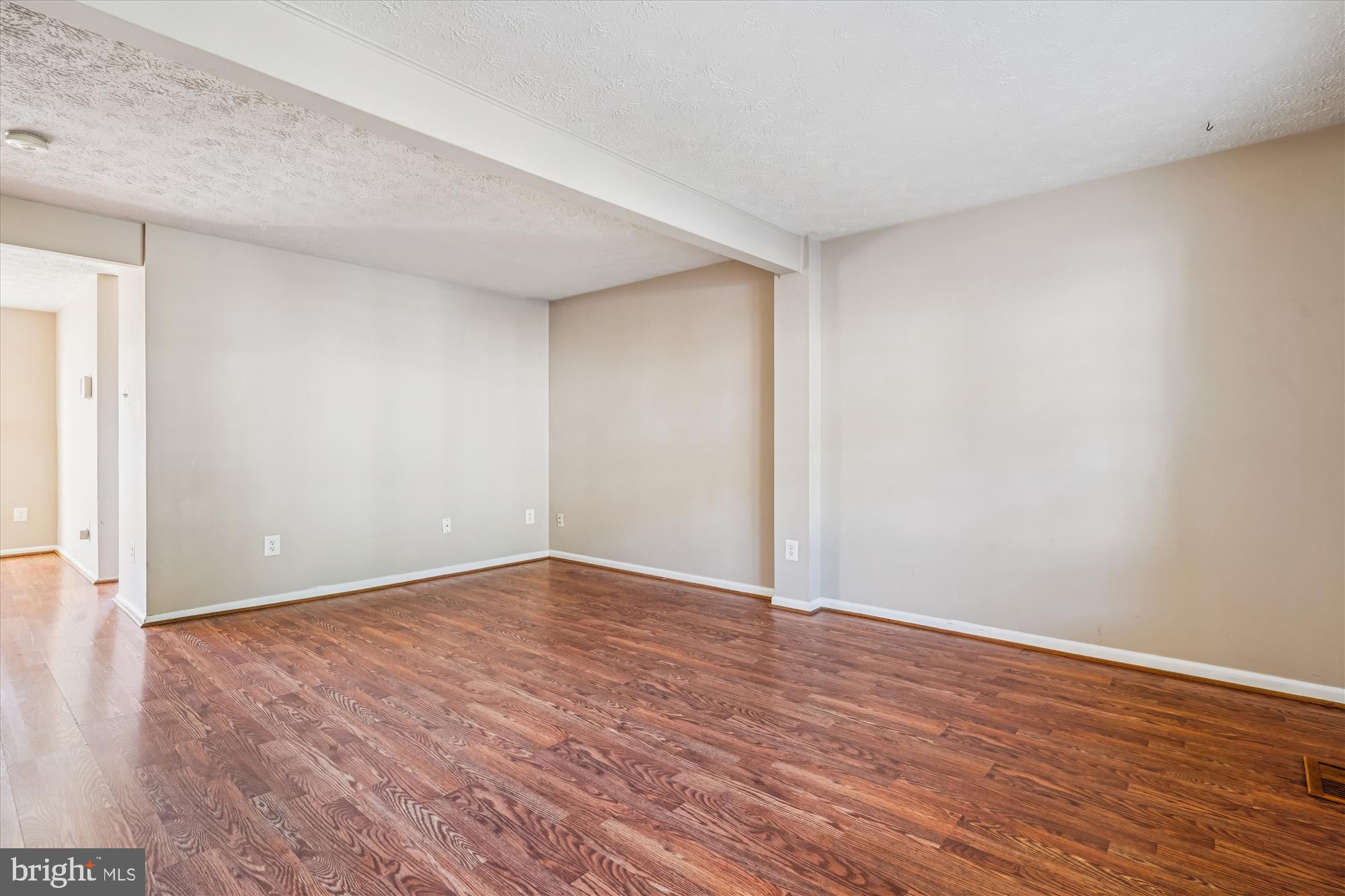 14740 Winding Loop Woodbridge, VA 22191 - Photo 18 of 59 a view of an empty room with wooden floor