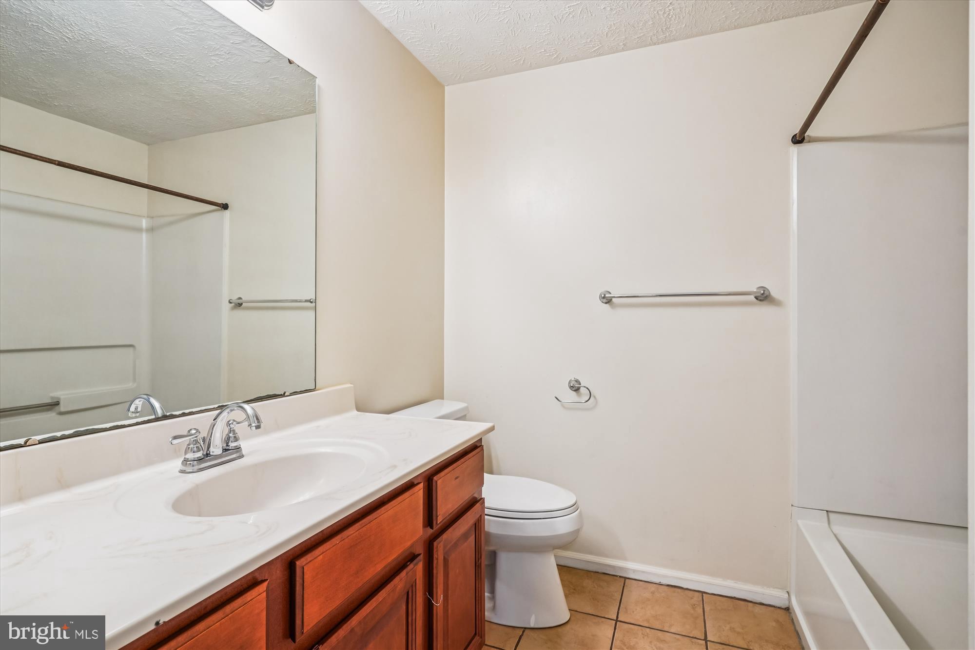 14740 Winding Loop Woodbridge, VA 22191 - Photo 22 of 59 a bathroom with a sink toilet and shower