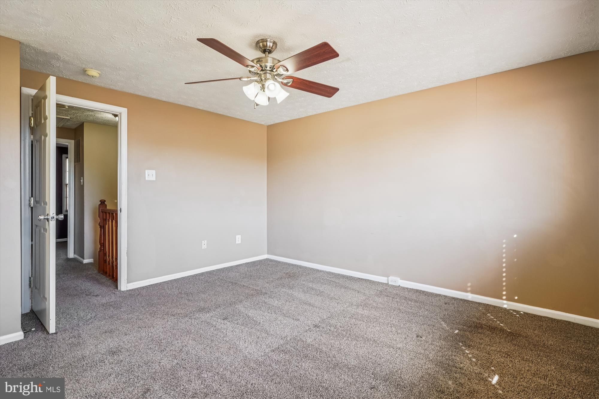 14740 Winding Loop Woodbridge, VA 22191 - Photo 30 of 59 an empty room with a ceiling fan and a window