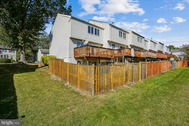 a view of a large building with a big yard and large trees