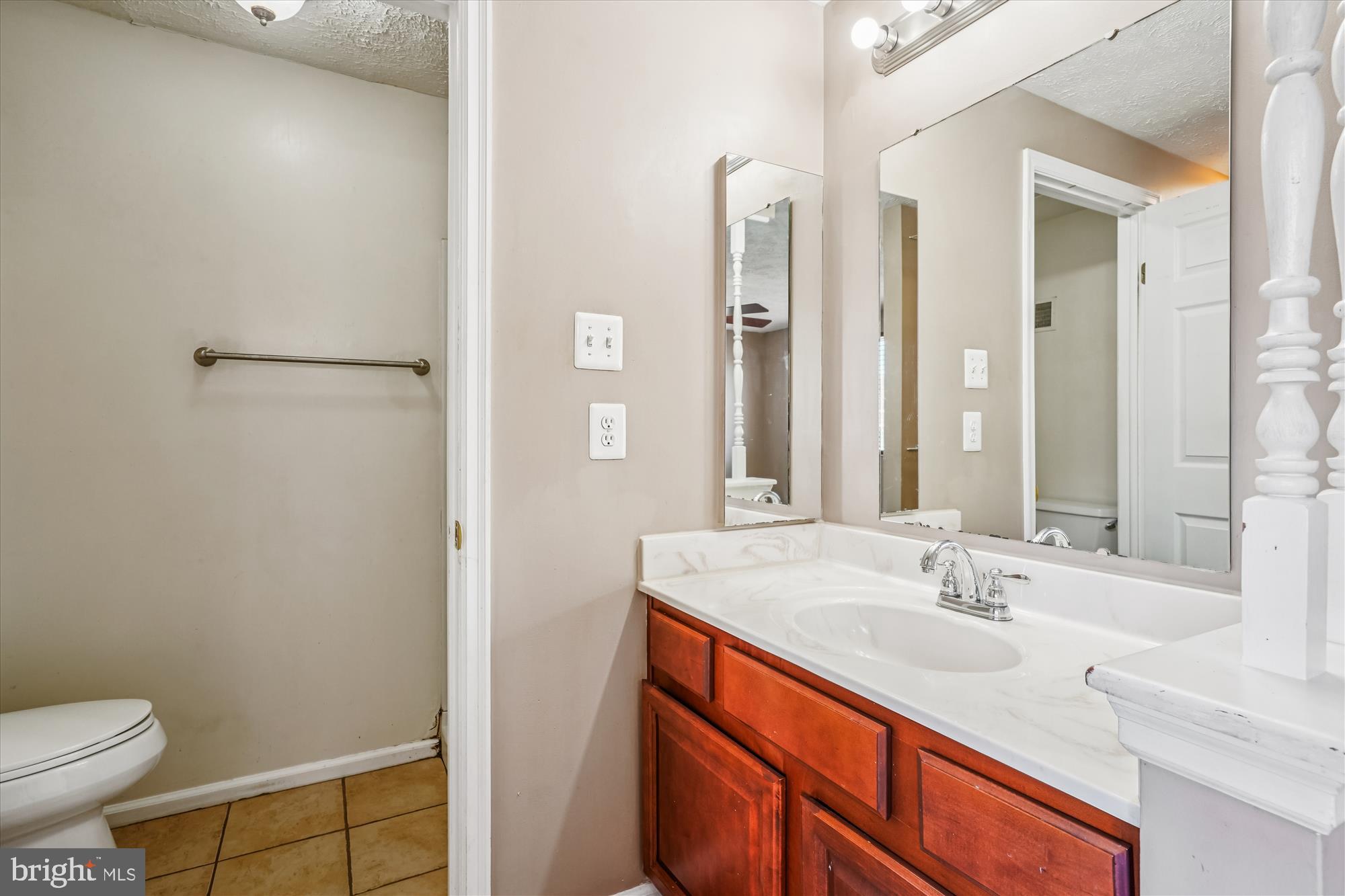 14740 Winding Loop Woodbridge, VA 22191 - Photo 33 of 59 a bathroom with a sink and a mirror