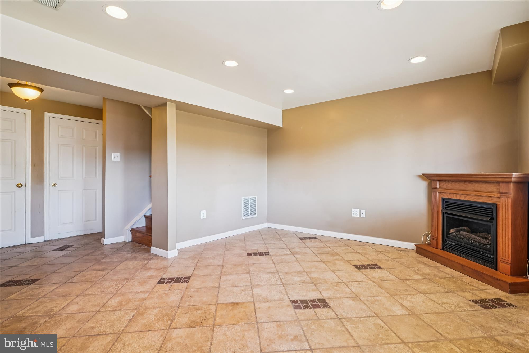14740 Winding Loop Woodbridge, VA 22191 - Photo 39 of 59 a view of an empty room with a fireplace