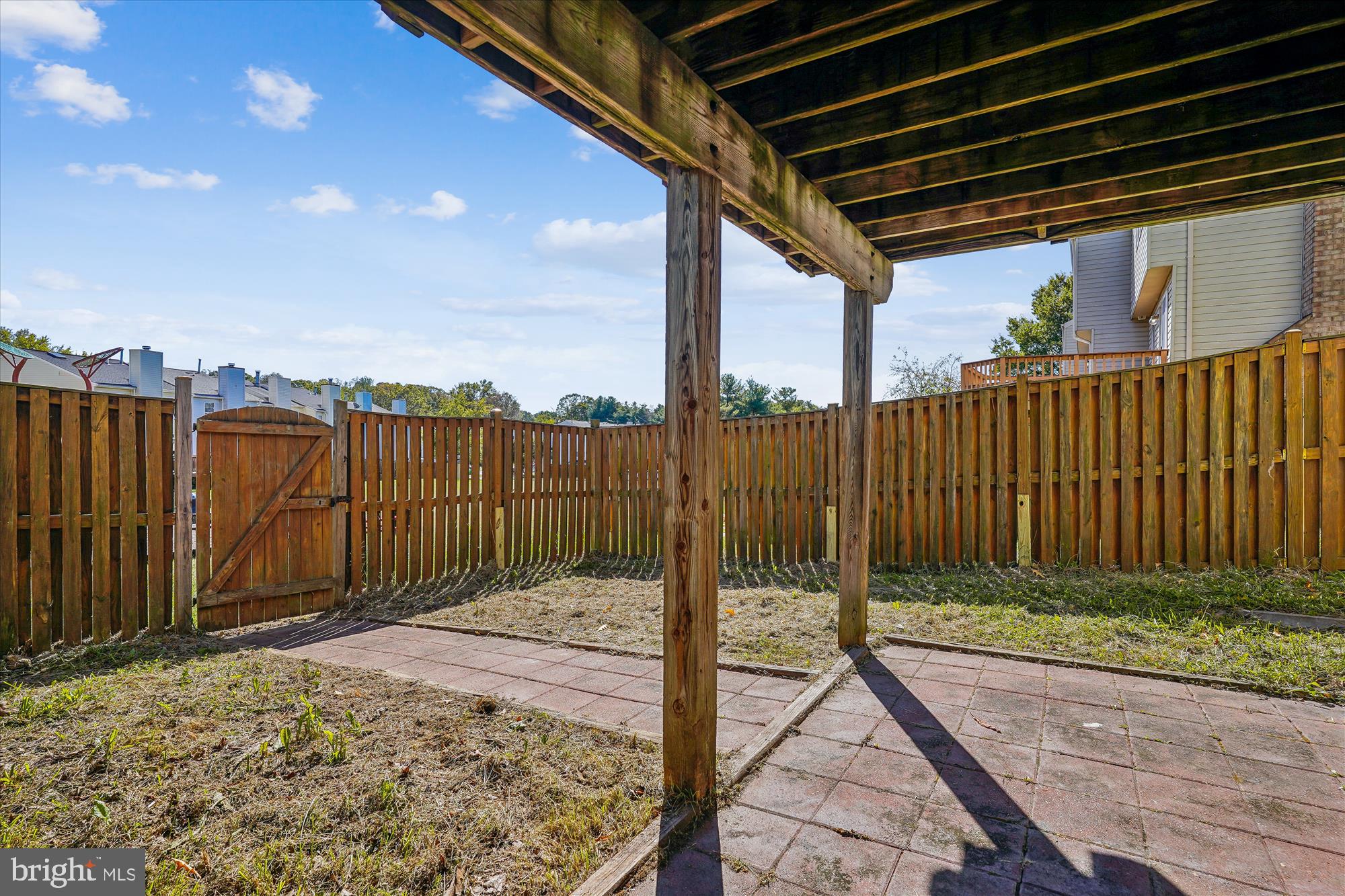 14740 Winding Loop Woodbridge, VA 22191 - Photo 4 of 59 a view of a backyard with wooden fence