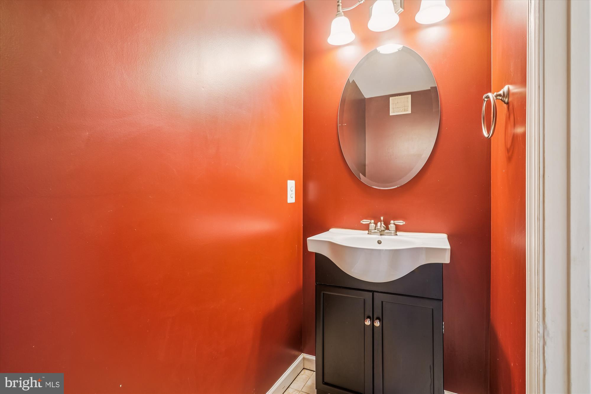 14740 Winding Loop Woodbridge, VA 22191 - Photo 42 of 59 a bathroom with a sink and a mirror