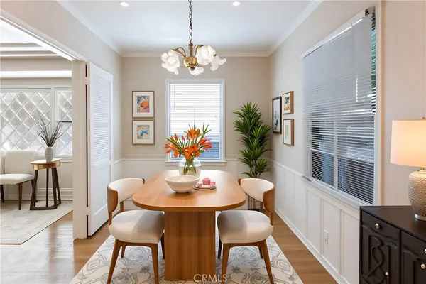 a view of a dining room with furniture window and wooden floor