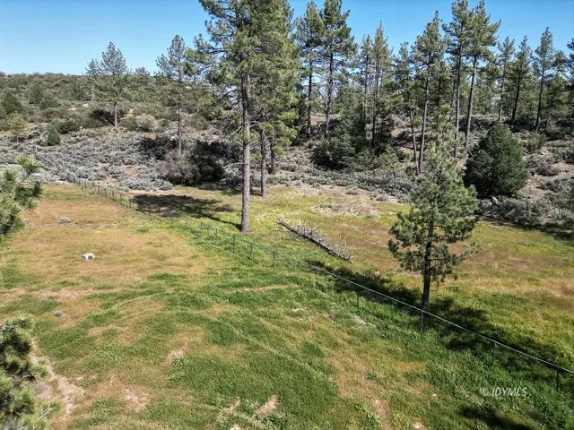 a view of a patio with two chairs and a table