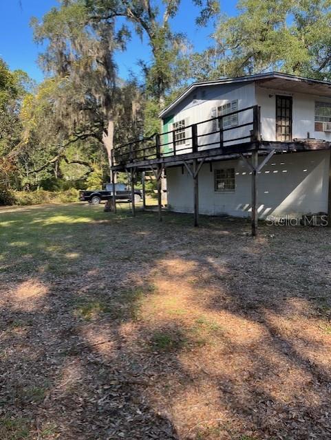 15720 Northeast 150 Terrace Fort McCoy, FL 32134 - Photo 10 of 11 a view of a house with a back yard