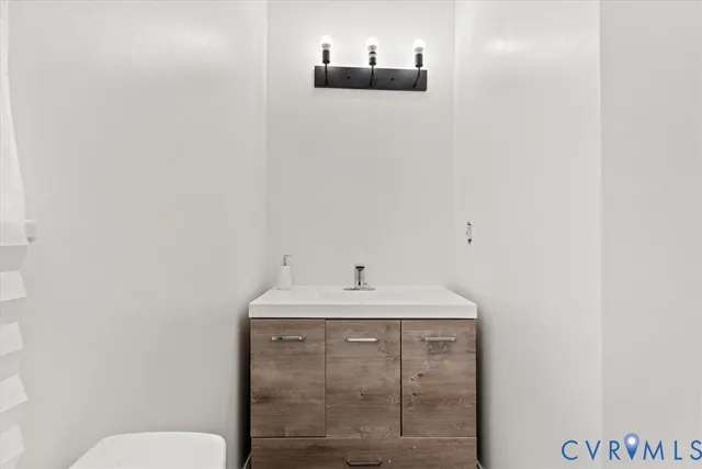 a bathroom with a sink and a toilet