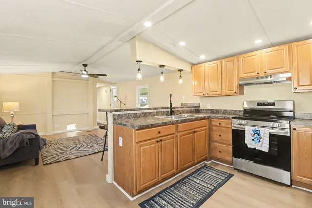 a kitchen with a refrigerator a sink and dishwasher