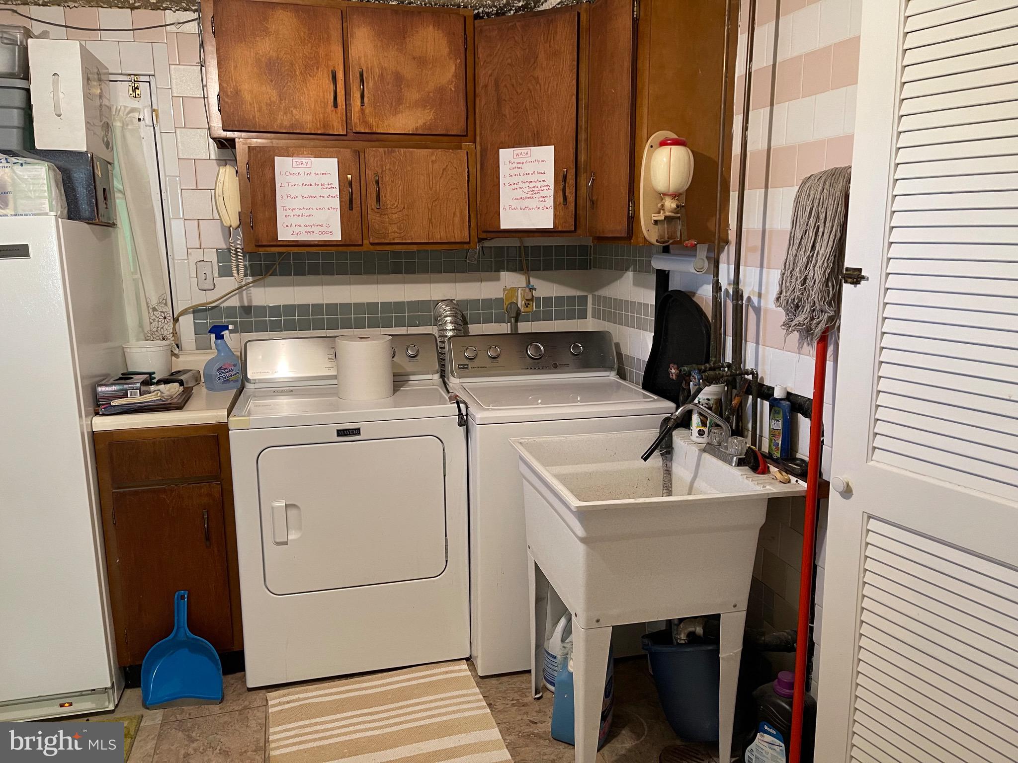 12815 Glynis Road Clinton, MD 20735 - Photo 23 of 39 Maytag washer and dryer with laundry sink