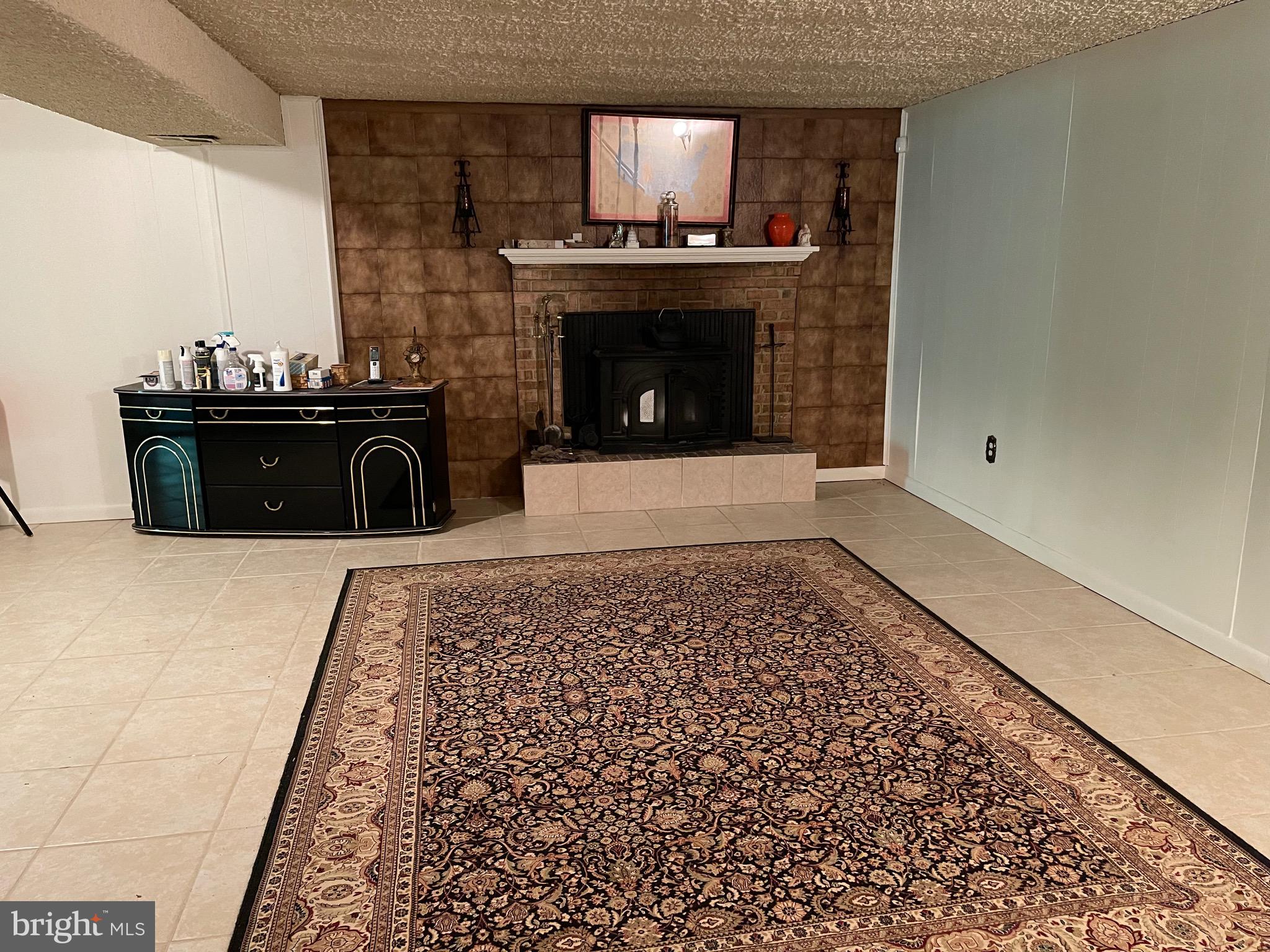12815 Glynis Road Clinton, MD 20735 - Photo 27 of 39 Family room with wood burning fireplace