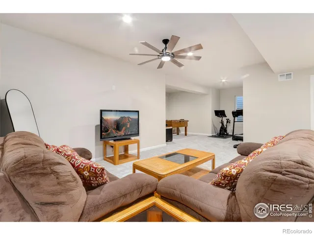 a spacious bedroom with a bed and a table in it