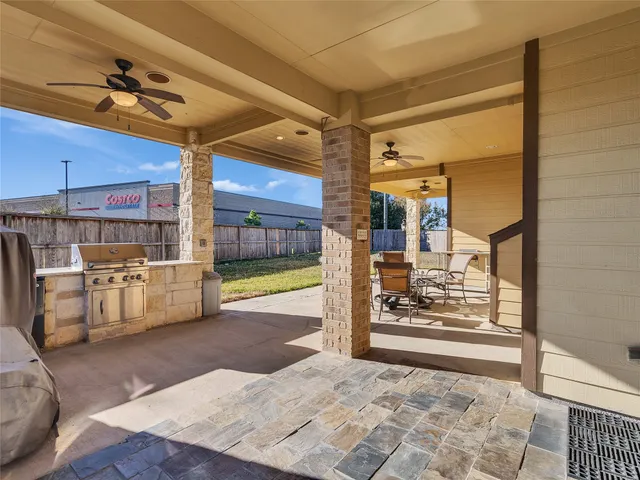 a living room with furniture and a painting on the wall