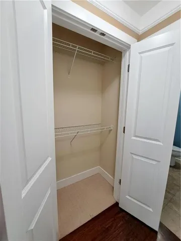 a view of an empty walk in closet