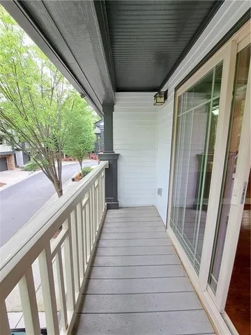 a view of a house with wooden deck
