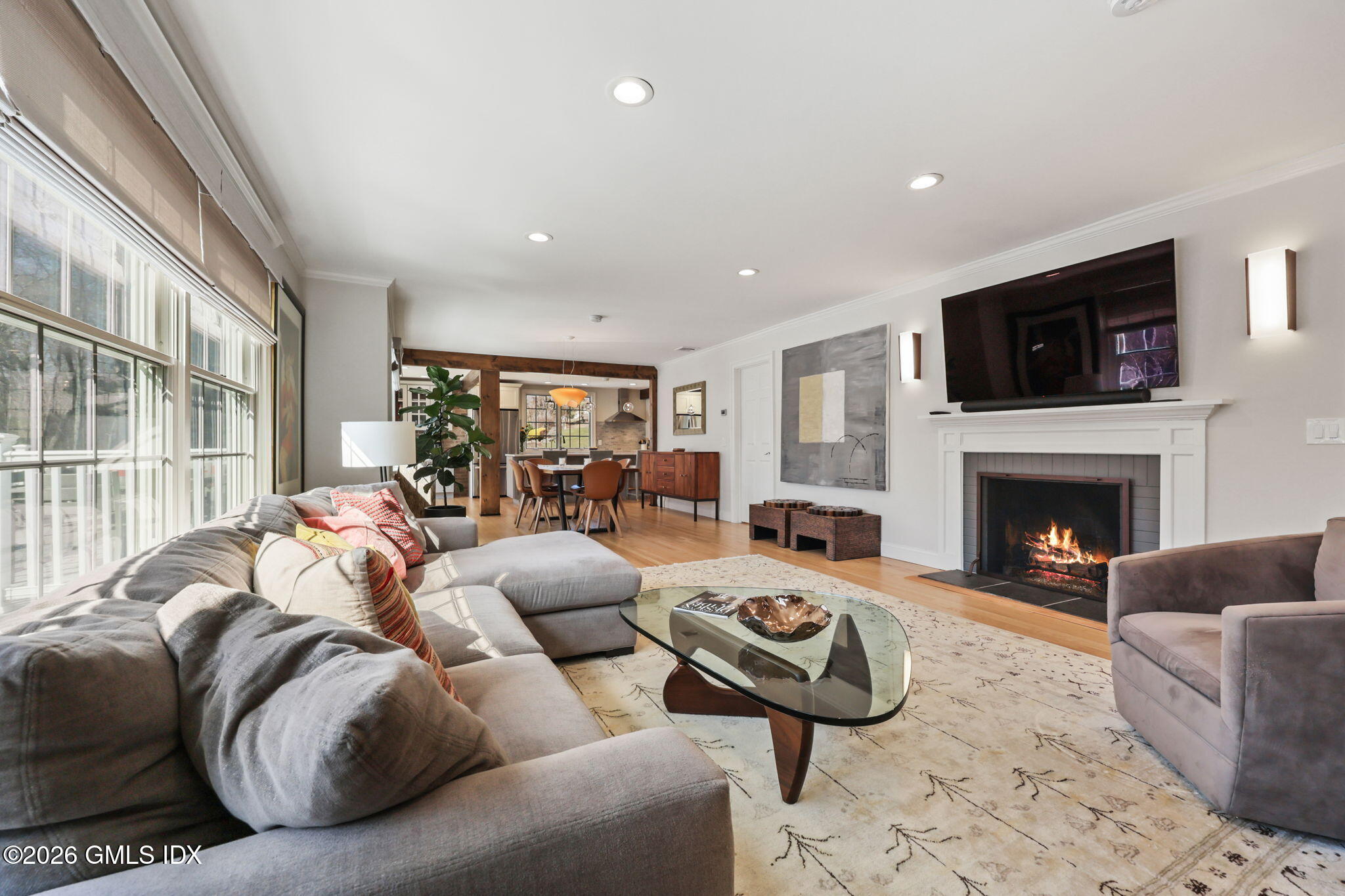 97 Davenport Ridge Lane Stamford, CT 06903 - Photo 8 of 31 a living room with furniture fireplace and flat screen tv