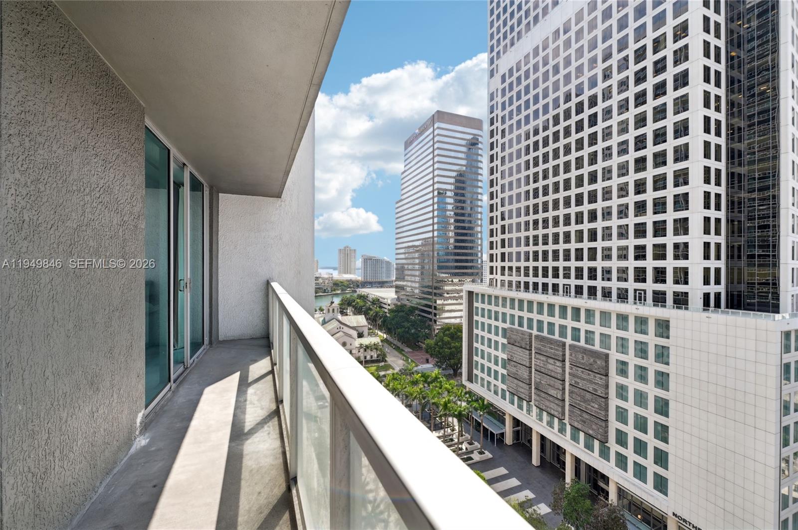 55 Southeast 6th Street, Unit 1608 Miami, FL 33131 - Photo 12 of 24 Expansive balcony with breathtaking views of Miami’s financial district and Biscayne Bay.