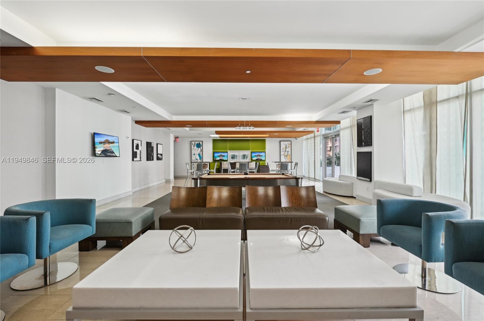 55 Southeast 6th Street, Unit 1608 Miami, FL 33131 - Photo 15 of 24 Luxury Brickell lobby featuring concierge service and sophisticated lounge areas.