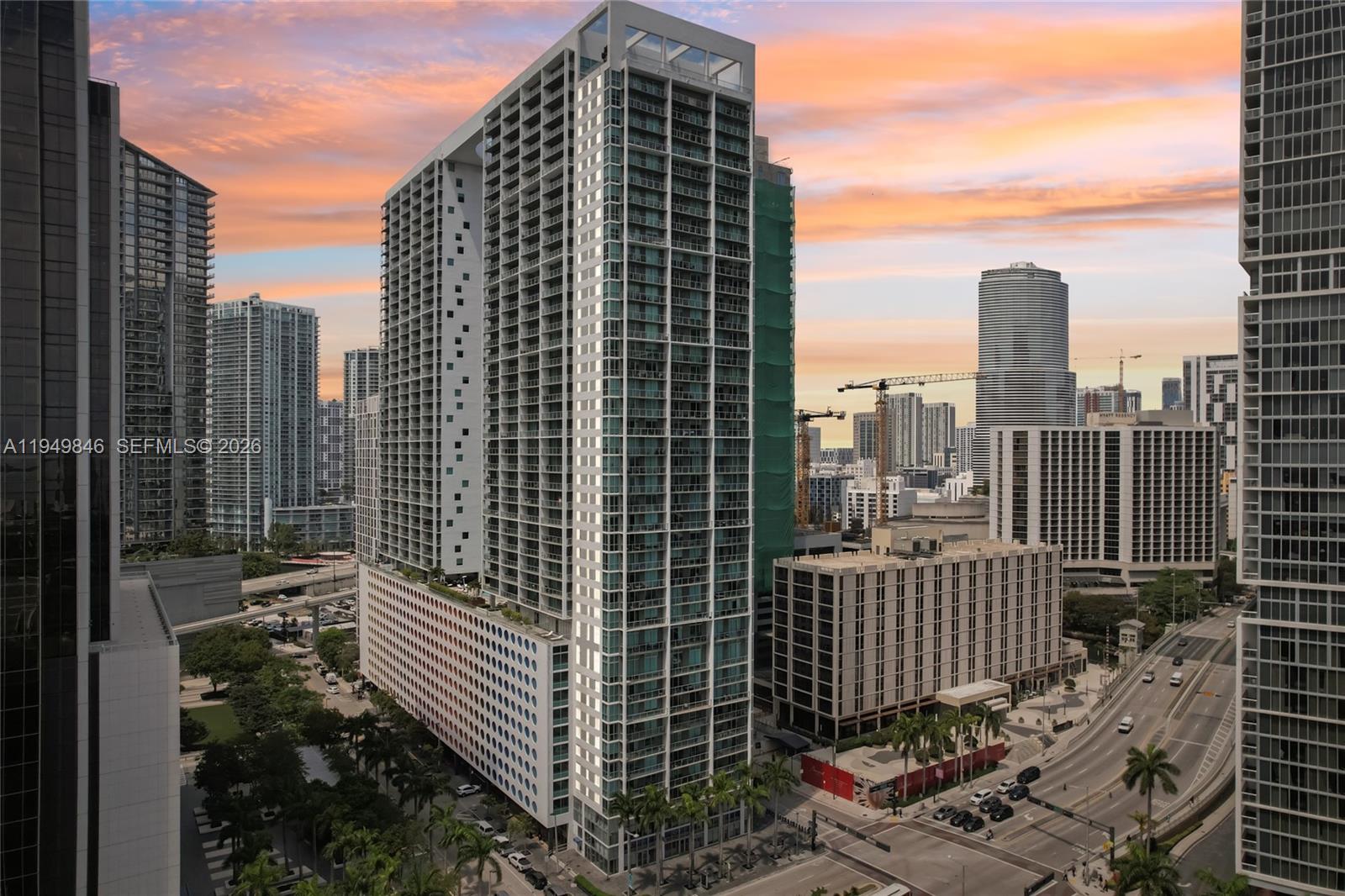 55 Southeast 6th Street, Unit 1608 Miami, FL 33131 - Photo 22 of 24 Beautiful sunset skyline over Brickell and Biscayne Bay from private balcony.