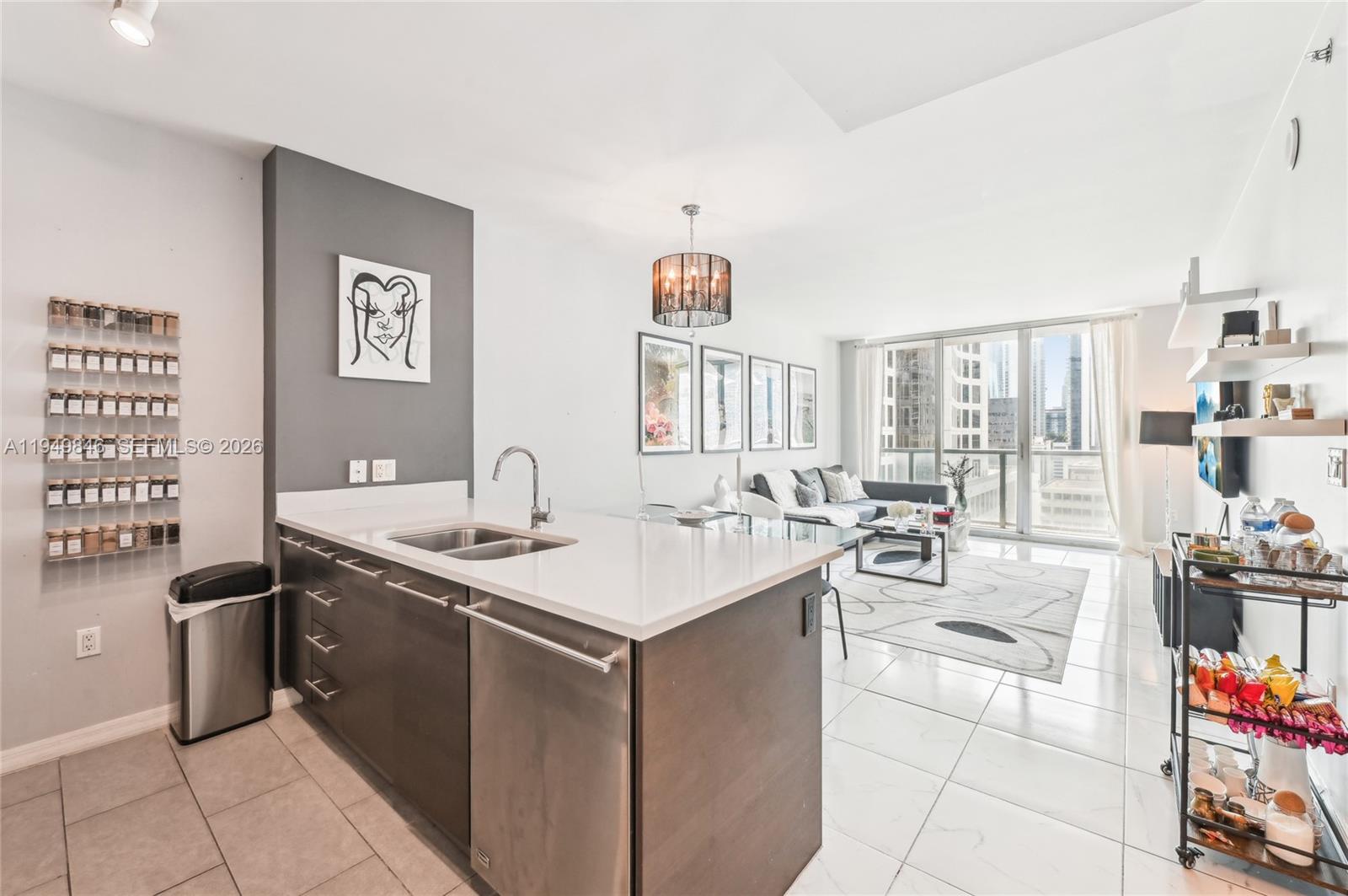 55 Southeast 6th Street, Unit 1608 Miami, FL 33131 - Photo 5 of 24 Contemporary kitchen with quartz countertops, stainless steel appliances, and modern cabinetry. Perfect for entertaining.