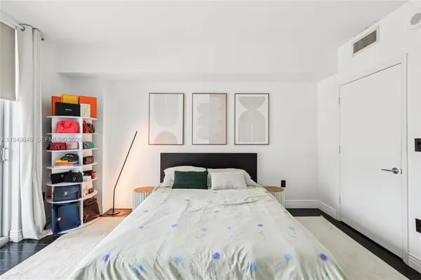 a bedroom with a bed and closet