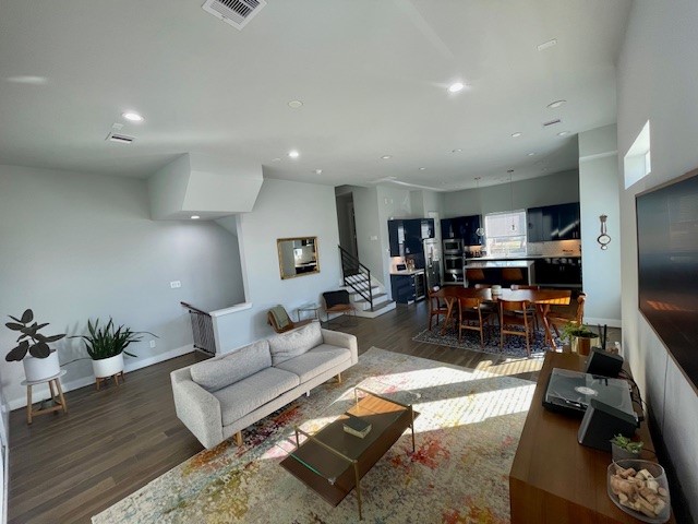 808 Fisher Street, Unit A Houston, TX 77018 - Photo 14 of 33 a living room with furniture a wooden floor and a flat screen tv