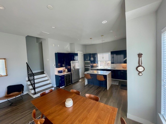 808 Fisher Street, Unit A Houston, TX 77018 - Photo 16 of 33 a living room with furniture a flat screen tv and kitchen view