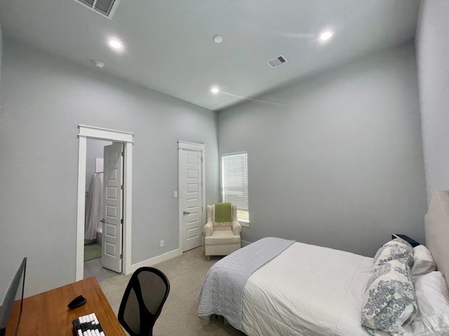 808 Fisher Street, Unit A Houston, TX 77018 - Photo 7 of 33 a bedroom with a bed and a dresser