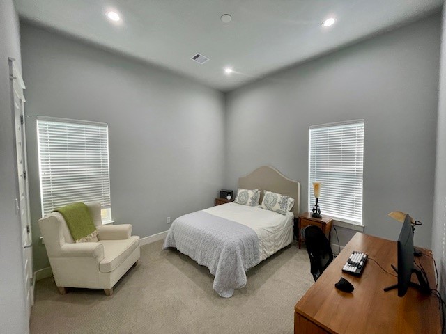 808 Fisher Street, Unit A Houston, TX 77018 - Photo 8 of 33 a bedroom with a bed and a couch