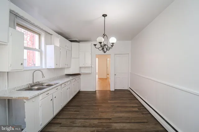 a bathroom with a sink a toilet and a bathtub
