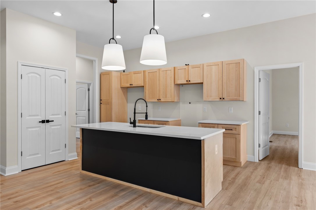 333 Lone Oak Road Anderson, SC 29621 - Photo 12 of 36 This new construction kitchen offers abundant cabinet space and an inviting island, perfect for gathering.
