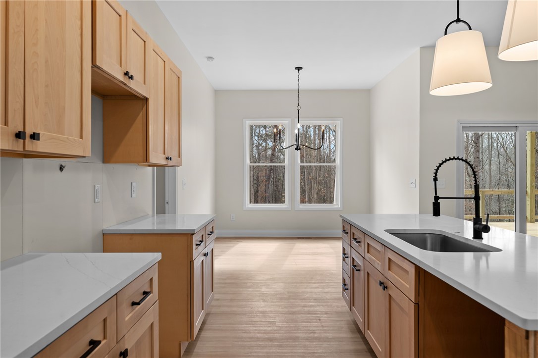 333 Lone Oak Road Anderson, SC 29621 - Photo 14 of 36 This spacious kitchen with light wood cabinetry and countertops offers ample room for culinary endeavors.
